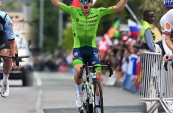 Slovenia's Tadej Pogacar celebrates winning the men's Elite road race, at the road cycling World Championships in Kigali, Rwanda.